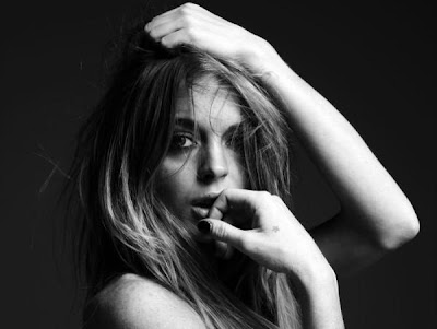 The always organic Hedi Slimane has shot Lindsay Lohan in his iconic simple