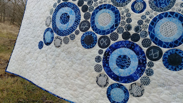 Modern snowflake quilt using Island Batik Alpine Ice fabrics