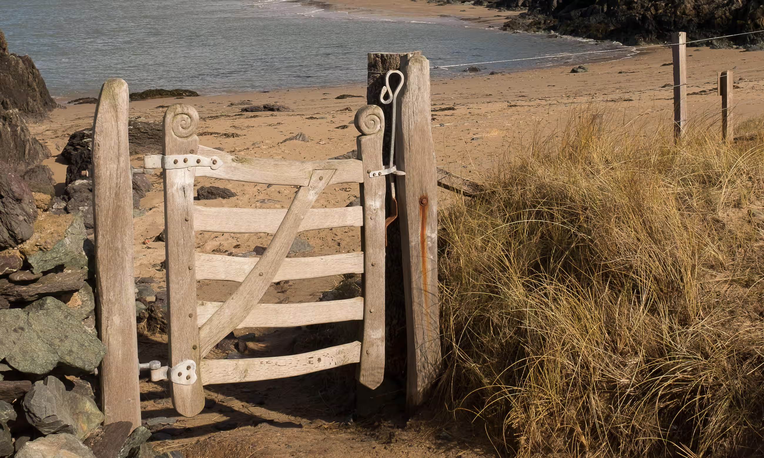 Magnificent Celtic spirals … Dafydd Davies-Hughes’ gate on Ynys Llanddwyn. Photograph: Mark Little/Alamy