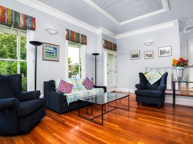 Entertainment room with a statement, shiny wooden flooring, which is hidden elsewhere in the house. 
