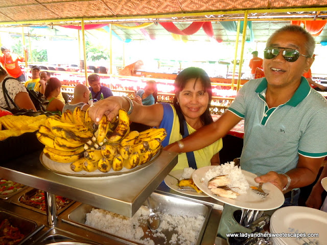 getting food while cruising at Loboc River Bohol