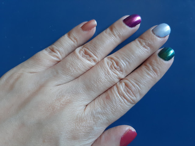More one picture of the hand with each nail painted with a different colour of the nail enamel from the limited edition Magical Crystal from Avon