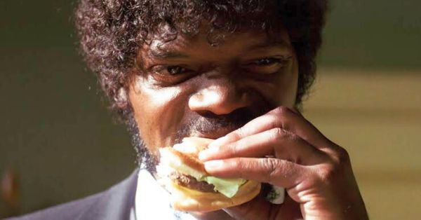 The scene where Jules is taking a bite from Brett's burger