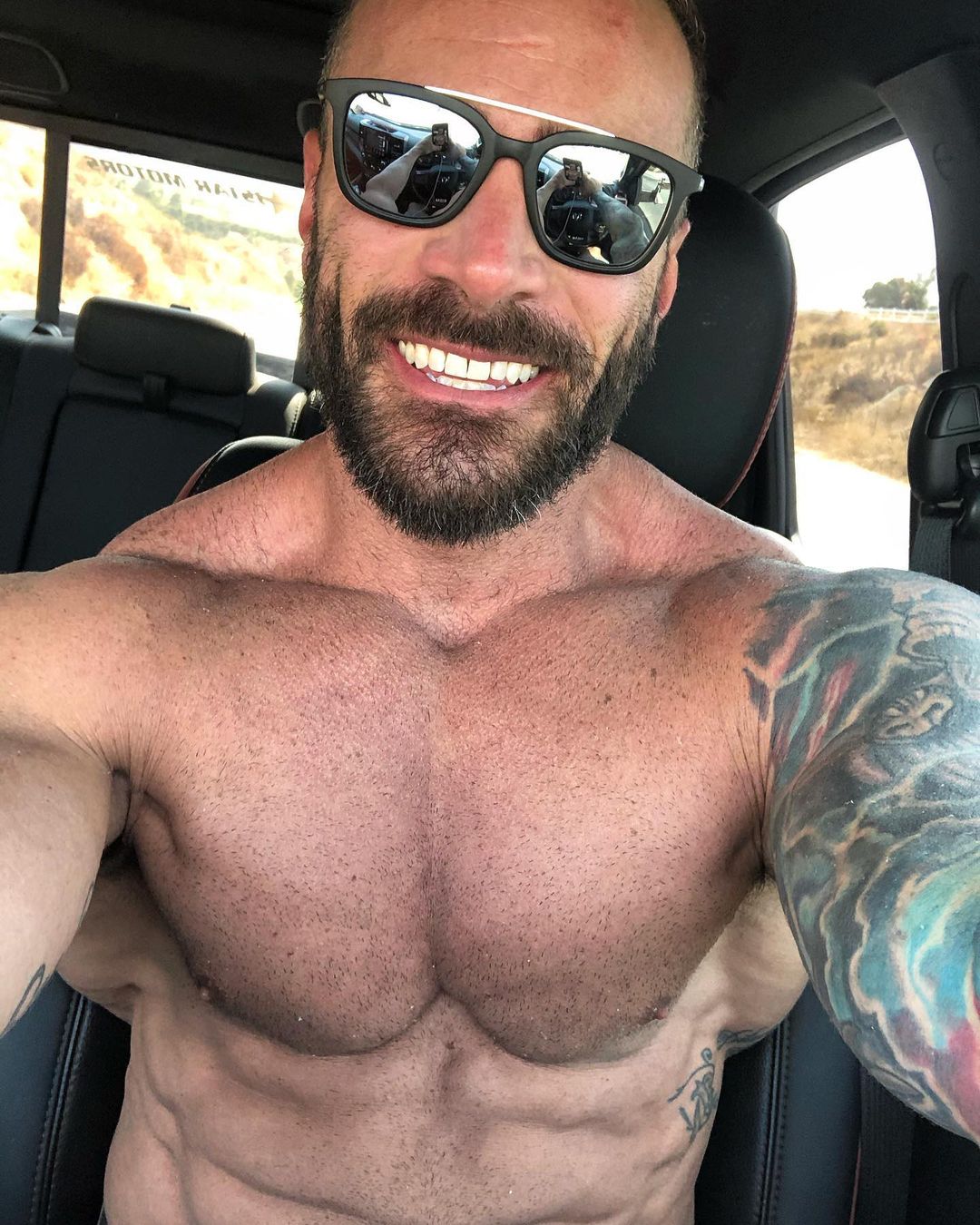 strong-sexy-bearded-man-parker-egerton-smile-shirtless-body-tattoo-daddy-selfie