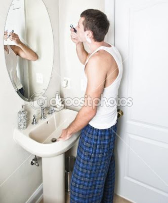 Young-Man-in-Bathroom-Shaving - What Men Want in your bathroom