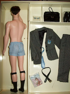 Full length back view of Ken in his blue checked boxers