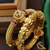 Broad gold bangles 