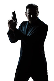   Image:  A man in a suit holds handgun.  Will A Preacher Man Rob God by collecting tithes and not taking care of the widow, the immigrant, the orphan?