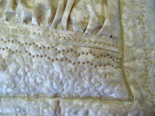 A close up of Patty's pillow with her stitch variations.