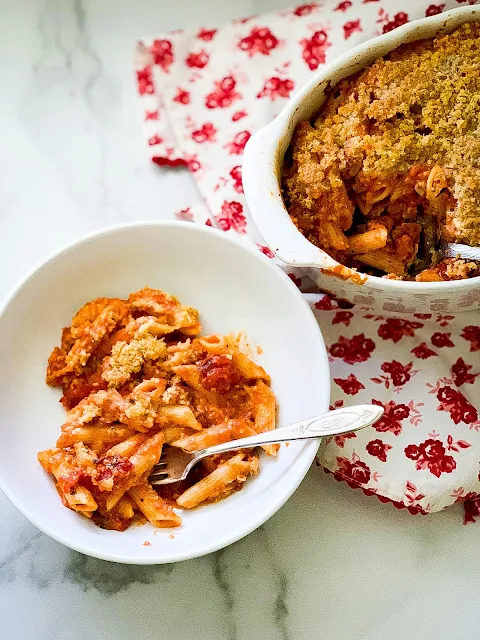 Baked Ziti is the ultimate comfort food for a crowd or just a family night dinner, rich and gooey with layers of pasta, creamy meat sauce, and three different kinds of cheese.