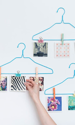 clothes hangers and pegs photo display