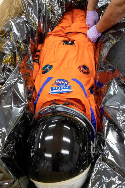 At Kennedy Space Center's Space Station Processing Facility in Florida, Commander Moonikin Campos is placed inside a crate for its trip back to the Johnson Space Center in Houston, Texas...on January 10, 2023.