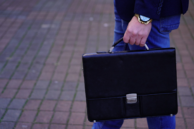 A Professional Man Carrying Black Leather Briefcase