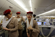 Emirates cabin attendants prepare the inside of an Airbus A380 aircraft for . (article dc )