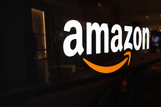 amazon sign over black shiny background