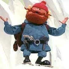 Yukon Cornelius from 'Rudolph the Red-Nosed Reindeer' on the ice shrugging