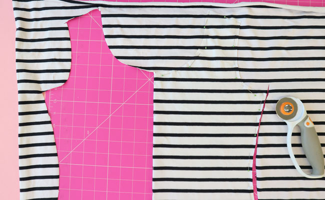 Bodice pinned on top of the other side as a guide to cut out the other side symmetrically on stripes.