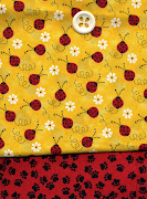 . ladybug print for the main dress, and the red puppy dog paw print for . (vet girl dress )