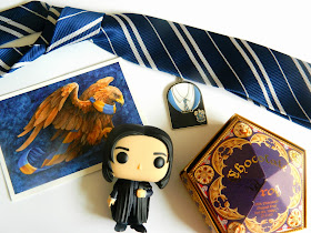 Flatlay of Harry Potter Ravenclaw Merch and a Pop figure of Snape
