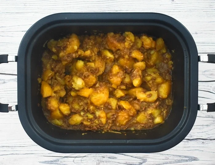 Overhead shot of Scottish Stovies in slow cooker pan