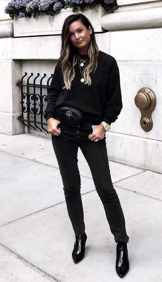 black outfit inspiration | sweatshirt + waist bag + skinny jeans + boots