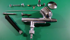 The disassembled airbrush