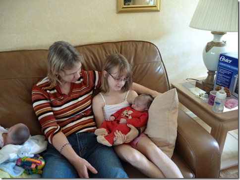 Rachel holding Ethan first time