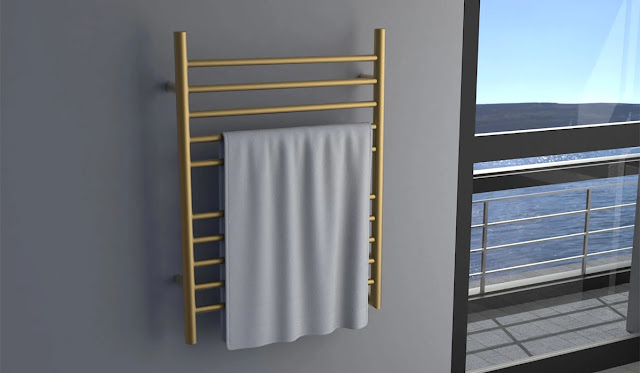 Brass towel warmer in a cozy bathroom.