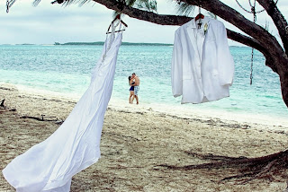 ALT="Bahamas Wedding Photography, Trash-the-Dress, clothes hanging from tree, Exuma Bahamas"