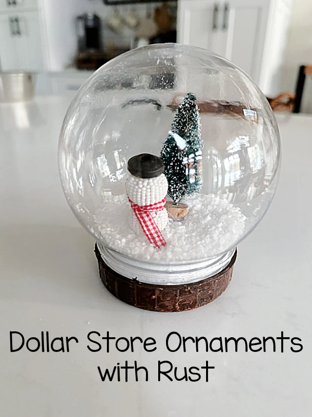 snow globe ornament with rusty base