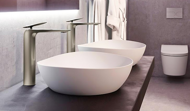 Ceramic vessel sinks by Toto on a double vanity.