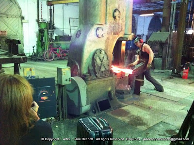 Jane Bennett, industrial heritage artist painting the blacksmiths of 'Wrought Artworks' Australian Technology Park Eveleigh Railway Workshops