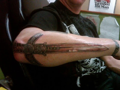 Labels Sword Tattoo Style on Hand Man