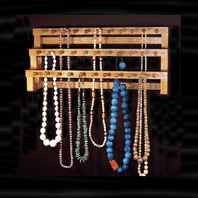 three-tiered wood rack for necklaces