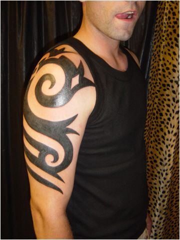 Tribal Arm And Shoulder Tattoo