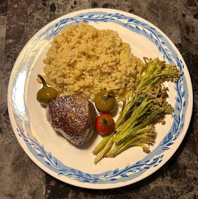 Seared petite prime filet mignon with mushroom risotto and roasted baby cauliflower