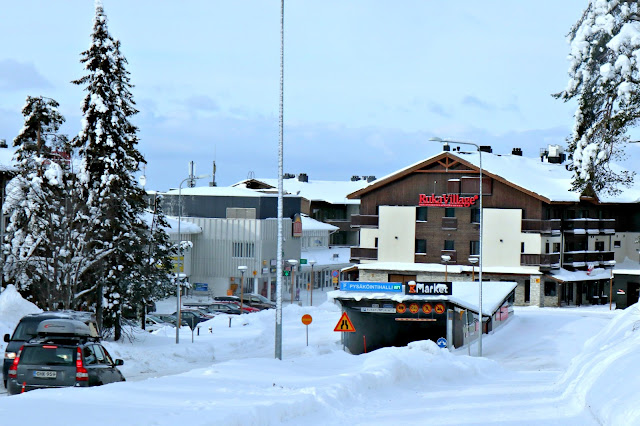 A very snowy entrance to Ruka Village, taken from up a hill. 