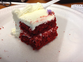 Slice of red velvet cake with cream cheese frosting