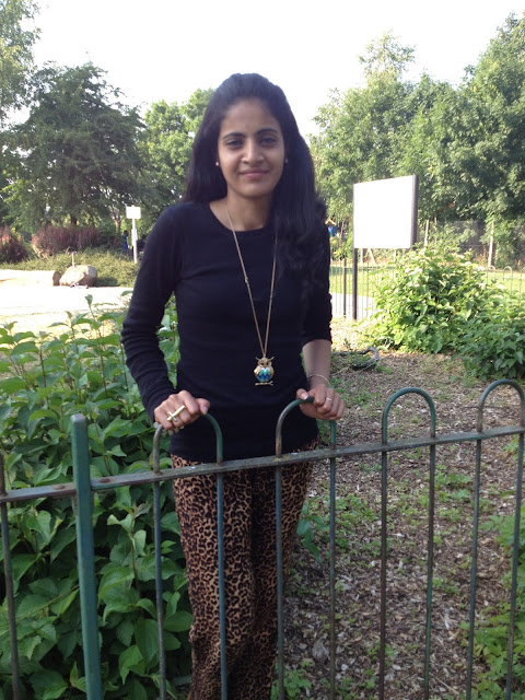 leopard print pants and owl necklace