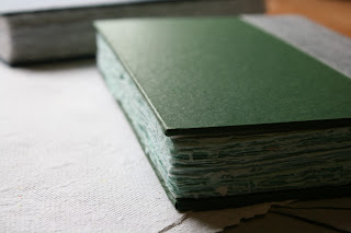 Green handmade notebook with recycled pages