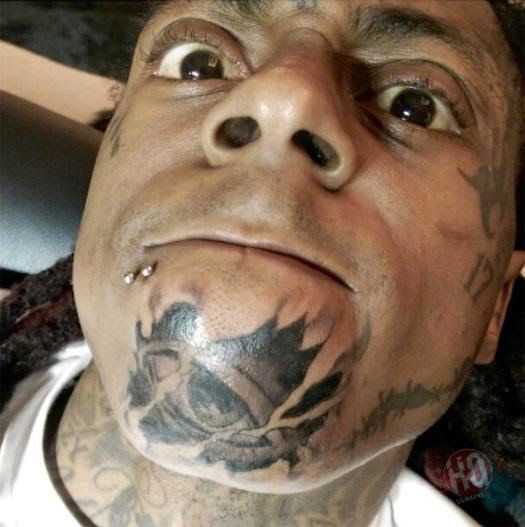 http://askkissy.com/2014/12/lil-wayne-got-new-illumanti-tattoo-horrfic-photos/3/