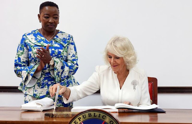 Queen Camilla wore a white dress and diamond brooch. President William Ruto and First Lady Rachel Ruto