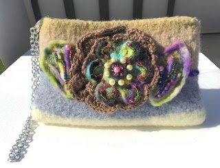 https://www.andreawagnerdesigns.com/collections/coin-purses/products/the-chocolate-rose-felt-bag-felt-purse-hand-knitted-beige-gray-and-tan-wool-handbag-womens-shoulder-bag-boho-chic-style