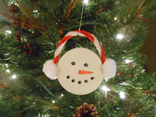 Snowman ornament from a plastic lid