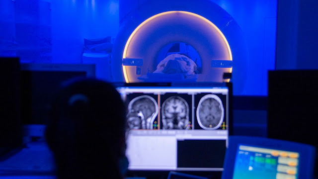 An MRI technologist assigned to Naval Medical Center San Diego conducts an MRI scan of a patient's brain.  (U.S. Navy photo by Mass Communication Specialist Seaman Luke Cunningham, DVIDS)