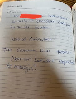 A diary entry from September 17th 1992. 'Mr [redacted] had a salad sandwich + a chocolate cake for his dinner today. Watched Crimewatch. The economy is in tatters. Norman Lamont is expected to resign!'