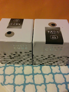 two boxed fidget cubes. Image from onequartermama.ca