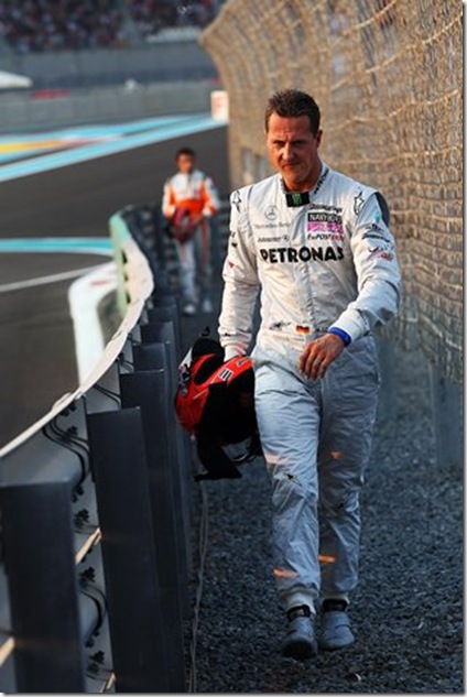 Michael Schumacher (GER) Mercedes GP walks in after crashing. Formula One World Championship, Rd 19, Abu Dhabi Grand Prix, Race, Yas Marina Circuit, Abu Dhabi, UAE, Sunday, 14 November 2010