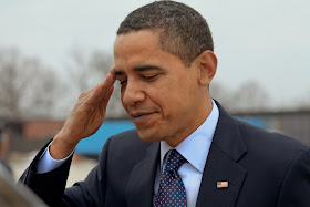 Barack Obama half-heartedly salutes U.S. soldiers