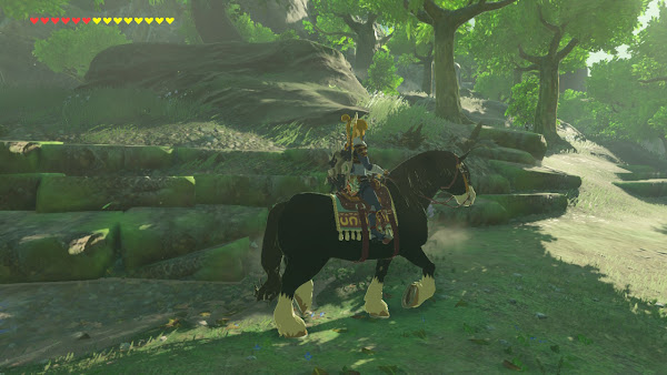 Screenshot of Breath of the Wild, showing Link riding through a lush forrest on a piebald horse.